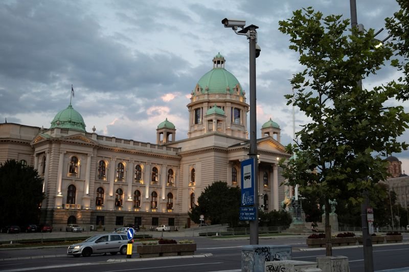 Smoke grenades tossed in Serbian parliament, lawmaker suffers stroke