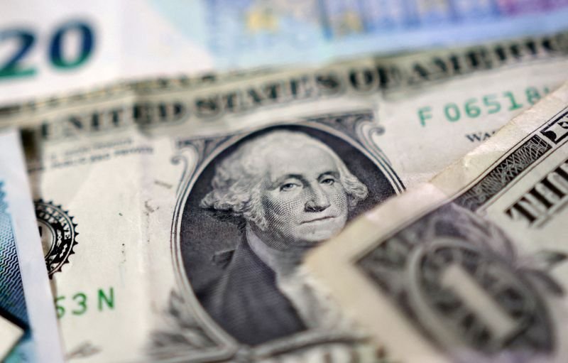 Dollar edges lower after US credit downgrade, Aussie pares losses before RBA